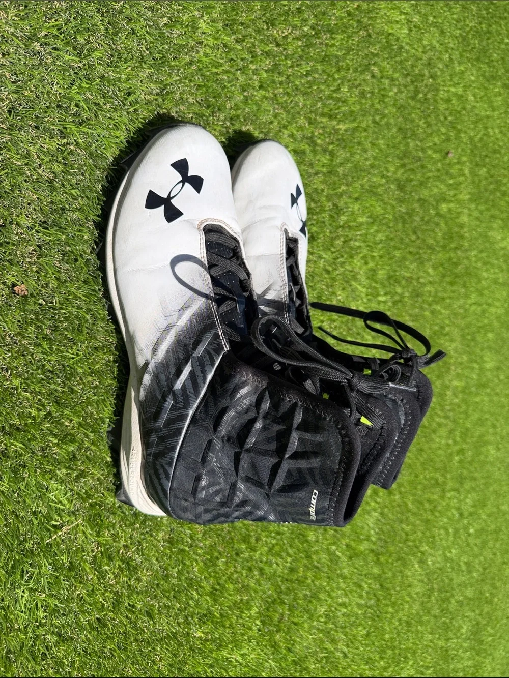 Under Armour Men’s White and Black High-Top Athletic Cleats